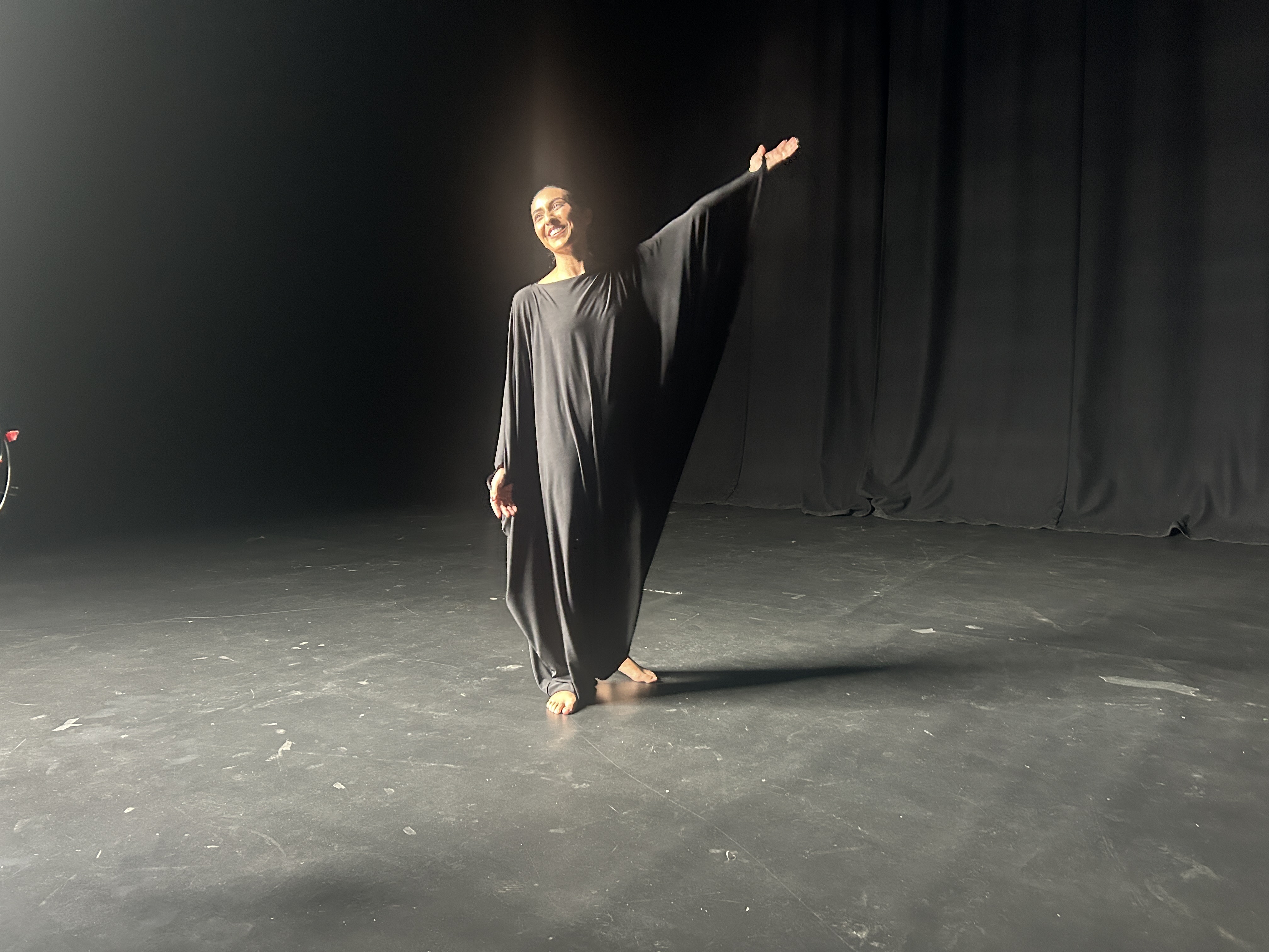 MaryAnn Chavez in the garment on set, fabric reading as a single continuous surface